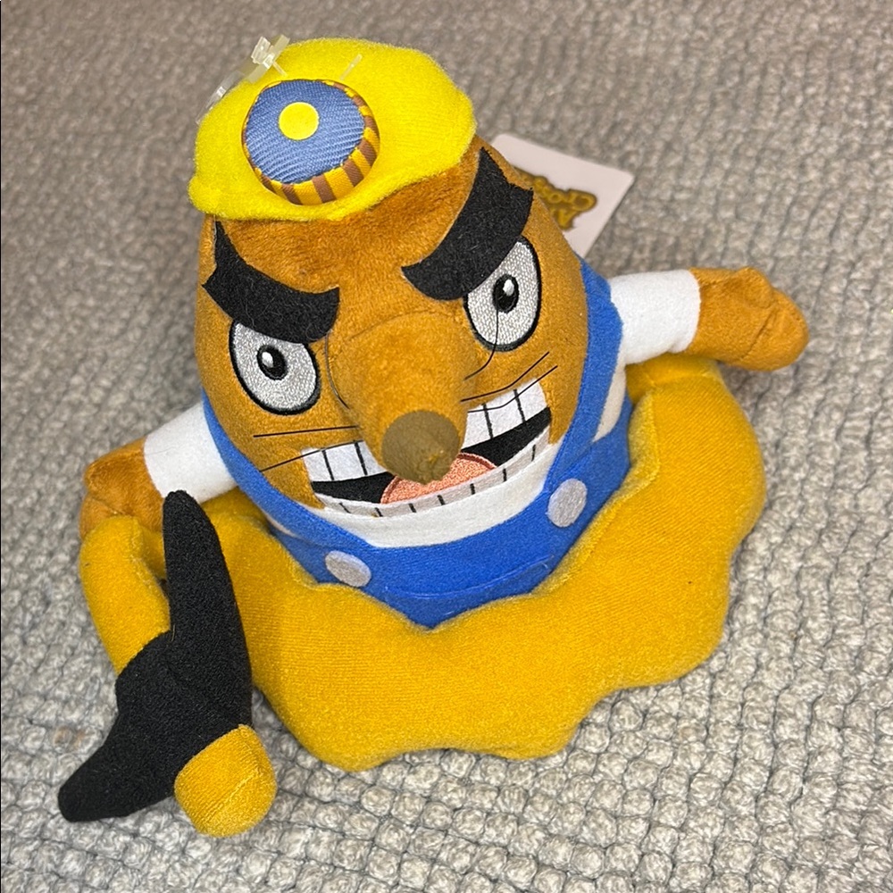 Yellow and Blue Stuffed Animal with Expressive Eyes